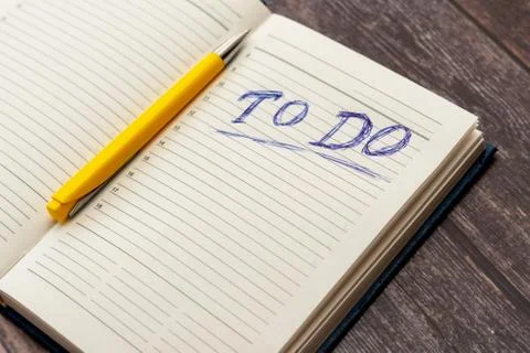To do list in opened business notebook and pen Stock Photos