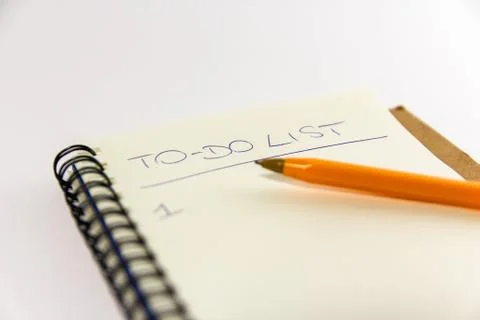 To do list in spiral notepad. White background, flat lay style. Stock Photos