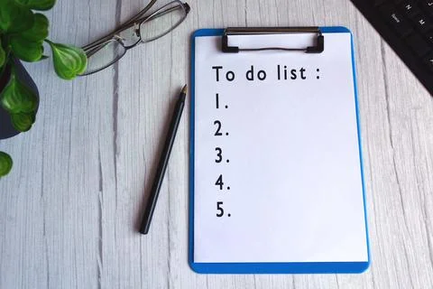 To do list text on blue clip board. Daily task concept Stock Photos