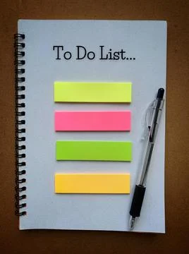 To Do List text on notepad with pen and colorful sticky note. Business concept Stock Photos