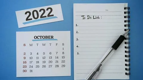 To do list text written on notepad for October month with pen and blue Stock Photos