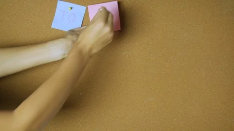 To do list for vivid day. Run-work-party-sleep. Hands pining sticky notes on pin Stock Footage 98517667