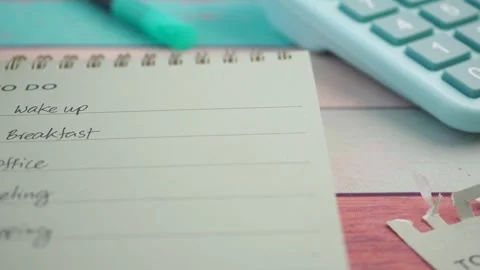 To do list written in notepad on wooden table with calculator and pen in ci.. Stock Footage 331900309