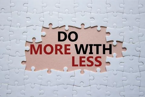 Do more with less symbol. Concept words Do more with less on white puzzle. .. Stock Photos