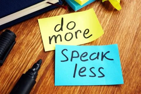 Do more speak less written on a color papers. Stock Photos