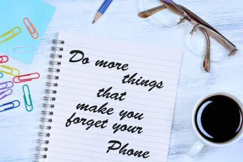 Do more things that make you forget your phone. Text on notebook Stock Photos