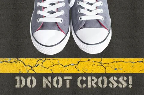 Do not cross concept with pair of gumshoes Foto stock