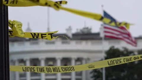 Do not cross lines waving in wind against White House facade Stock Footage 327177340