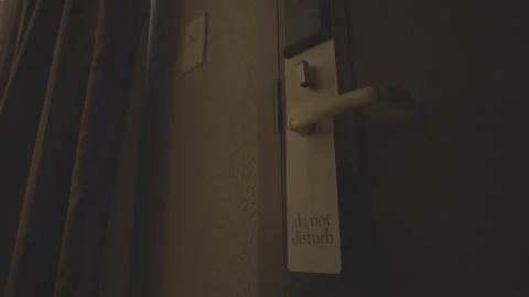 Do not disturb sign inside motel room Stock Footage 165465446