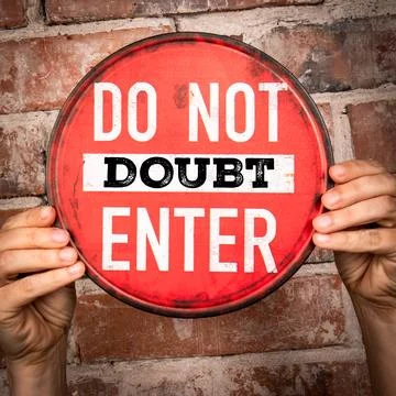 Do Not Doubt Enter Message on Red Warning Sign Held by Hands Stock Photos