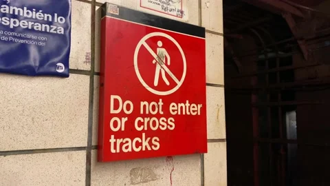 Do Not Enter or Cross Tracks Sign on New York City Subway Platform in Brook.. Stock Footage 228690397