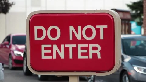 Do not enter rectangle red and white sign with cars vehicles lined up behind Stock-Footage 249760259