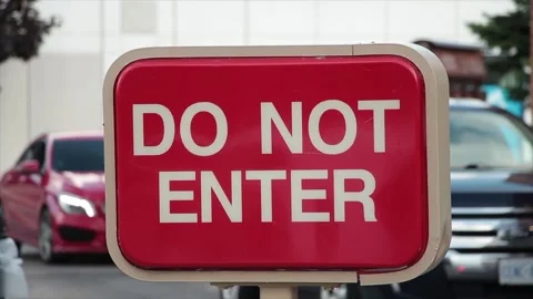 Do not enter rectangle red and white sign with cars vehicles lined up behind Stock Footage 249760309
