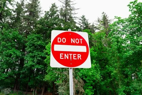Do Not Enter Sign Restriction Amidst Forest Area Stock Photos
