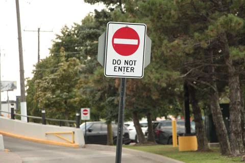 Do not enter vertical rectangle sign symbol on post with ramp behind and another Stock Photos