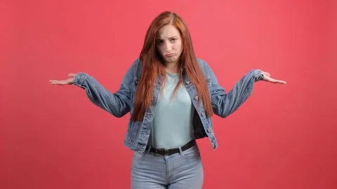 Do not know, sorry. Portrait of clueless young woman, feeling confused about Stock Footage 140783010