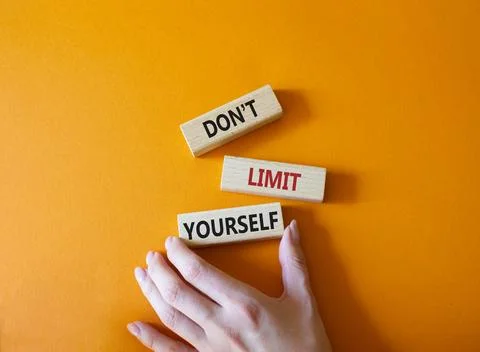 Do not limit yourself symbol. Concept words Do not limit yourself on wooden b Stock Photos