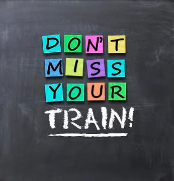 Do not miss your train text on blackboard Stock Photos