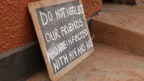 Do Not Neglect People With HIV And Aids Sign In Uganda, Africa. Closeup Stock Footage 278221647