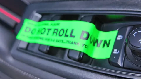 Do not roll down or wash windows, sticker on the vehicle door buttons, remi.. Stock Footage 315355788