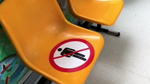 Do not sit here. Keep this seat free. Social distancing Stock-Footage 241600624