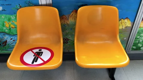 Do not sit here. Keep this seat free. Social distancing 스톡 동영상 241605771