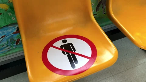 Do not sit here. Keep this seat free. Social distancing Stock-Footage 241605805