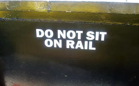 DO NOT SIT ON RAIL Fotos Stock