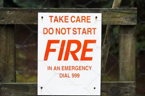 Do not start fire sign on gate in forest Stock Photos