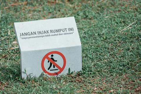 Do not step on the grass city sign for public facility Stock Photos
