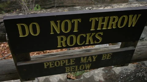 Do not throw rocks sign over Lucifer Falls Ithaca, NY Stock Footage 63306466