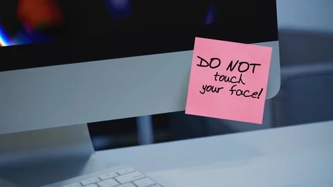 Do not touch your face. The inscription on the sticker on the monitor. Message.  Video stock 128267752