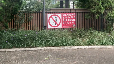 Do Not Urinate Here Sign in Jakarta, Indonesia Stock Footage 218446875