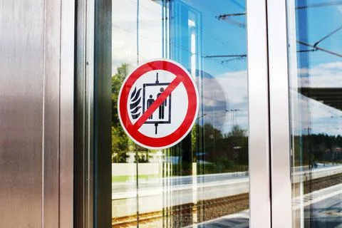 Do Not Use Elevator in Case of Fire Warning Sign on Glass Door Stock Photos