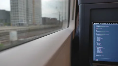 Do some coding in the train Stock Footage 186835370
