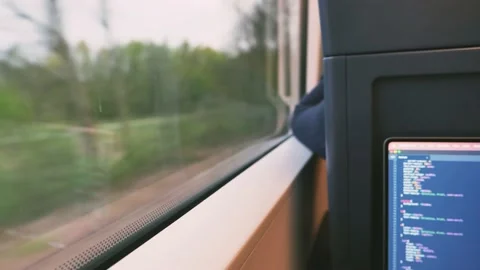 Do some coding in the train Stock Footage 186836099