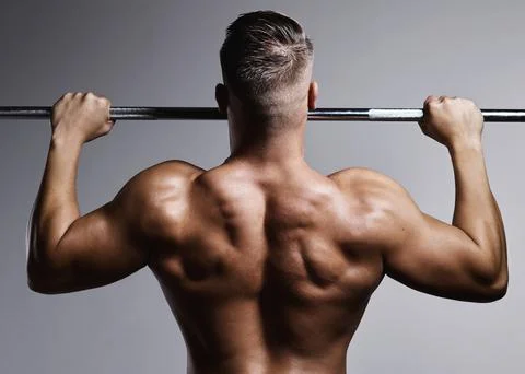 Do the work and watch your body change. Studio shot of a muscular young man Stock Photos