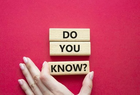 Do you know symbol. Concept word Do you know on wooden cubes. Businessman h.. Stock Photos