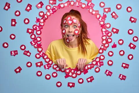 Do you rate my post in social network Funny redhead woman blogger get a lot of Stock Photos