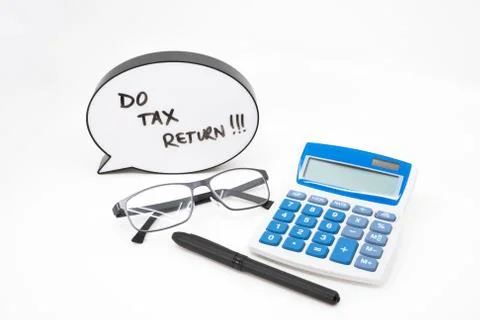 Do your tax return concept with text in speech bubble and calculator on white Stock Photos