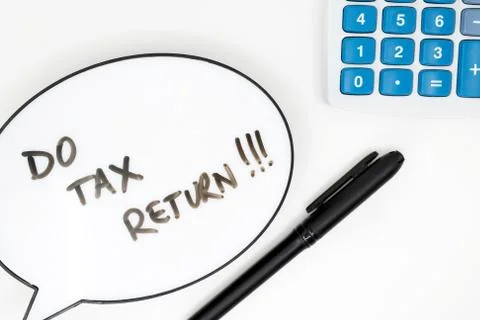 Do your tax return concept with text in speech bubble and calculator on white Stock Photos