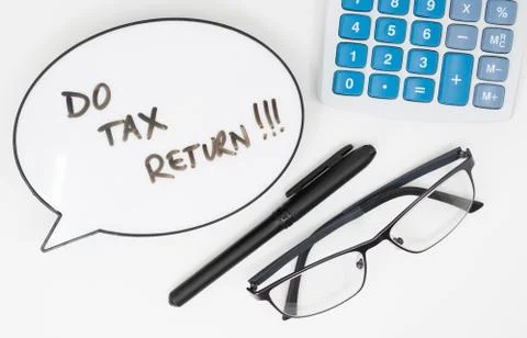 Do your tax return concept with text in speech bubble and calculator on white Stock Photos