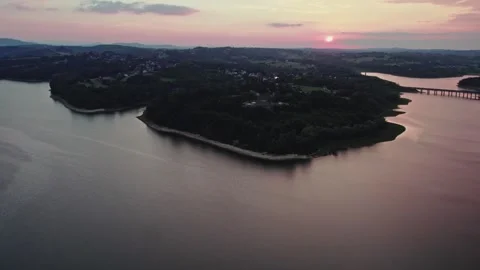 Dobczyce sunset river dolly drone shot Stock Footage 240570041