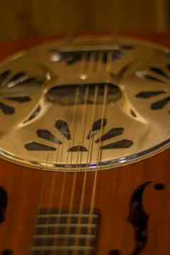 Dobro guitar on wall Stock Photos