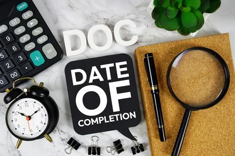 DOC - Date Of Completion acronym with calculator, alarm clock and magnifyin.. Stock Photos