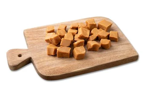 Doce de leite or dulce de leche, traditional south american milk candy over w Stock Photos