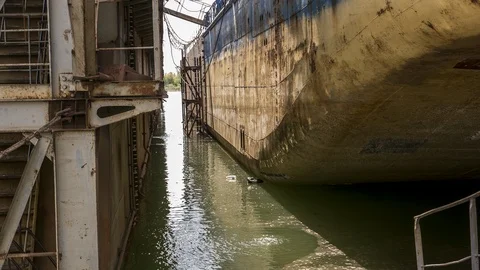 Dock with a barge is lowered under water . Stock-Footage 86240030