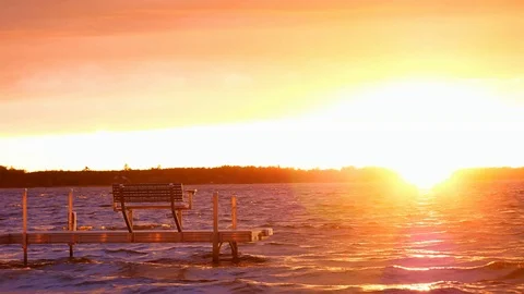 Dock with bench on lake at sunset in Bemidji, Minnesota. Stock Footage 89639017