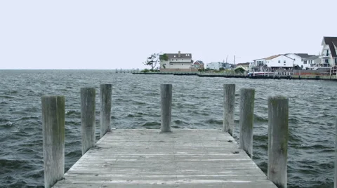 Dock on the blue ocean during the summer in New York Stock-Footage 64889412