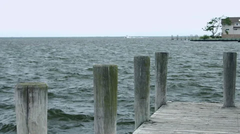 Dock on the blue ocean during the summer in New York Stock Footage 64889475